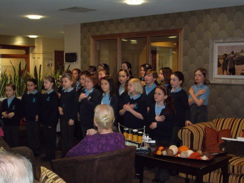  Our KS2 choir performing at Brick Kiln Place